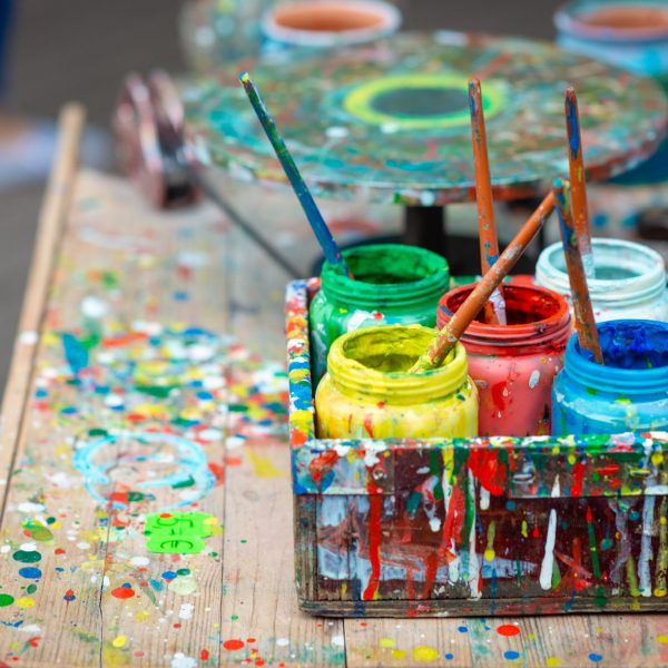 Containers with different colors the artist's outdoor workshop.