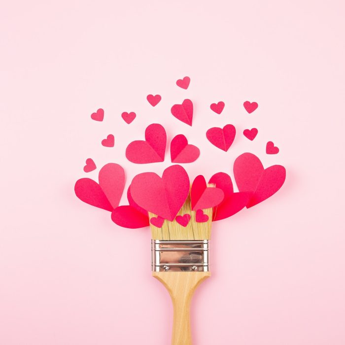 Paper hearts and paint brush over the pink pastel background. Love, Sainte Valentine, mother's